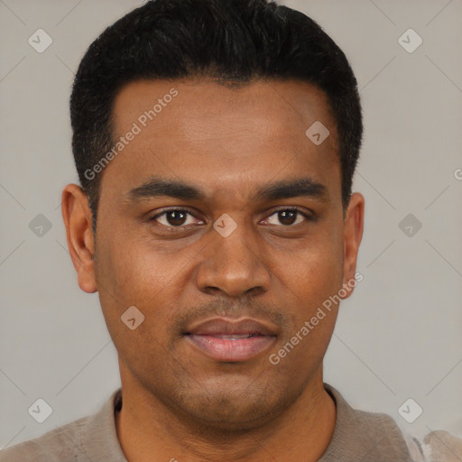 Joyful black young-adult male with short  black hair and brown eyes