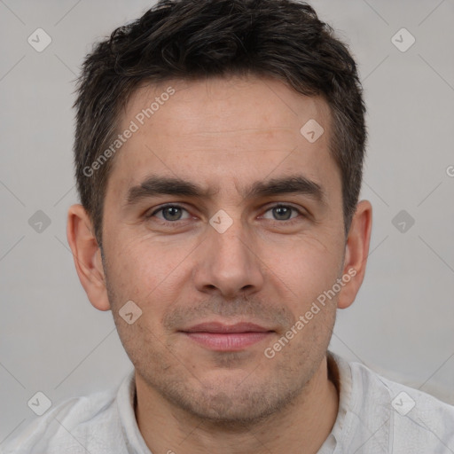 Joyful white young-adult male with short  brown hair and brown eyes