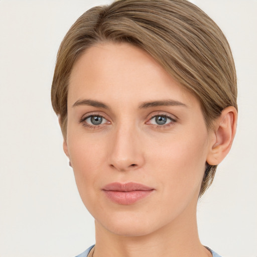 Joyful white young-adult female with short  brown hair and grey eyes