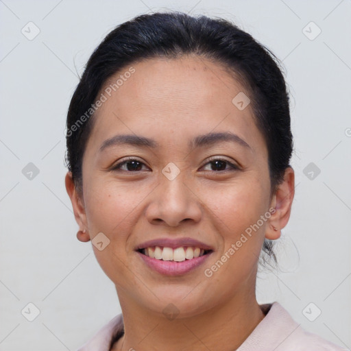 Joyful latino young-adult female with short  brown hair and brown eyes