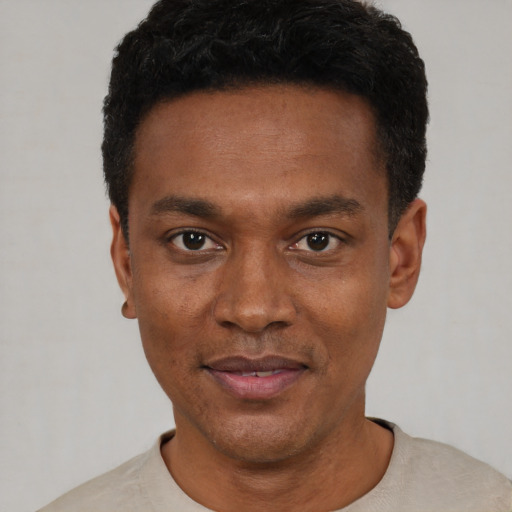 Neutral black young-adult male with short  black hair and brown eyes