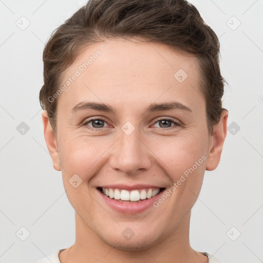 Joyful white young-adult female with short  brown hair and brown eyes