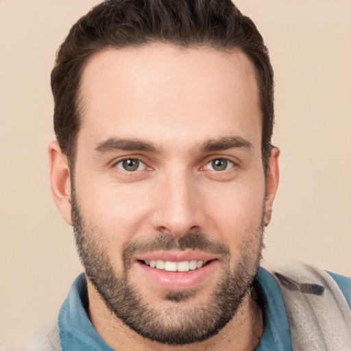 Joyful white young-adult male with short  brown hair and brown eyes