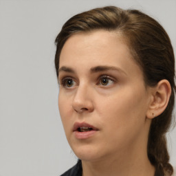 Neutral white young-adult female with medium  brown hair and brown eyes