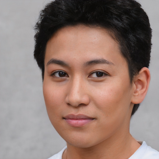 Joyful asian young-adult female with short  brown hair and brown eyes