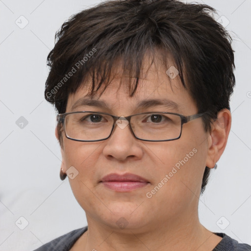 Joyful white adult female with short  brown hair and brown eyes