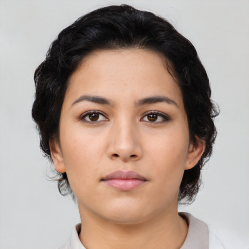 Neutral latino young-adult female with medium  black hair and brown eyes