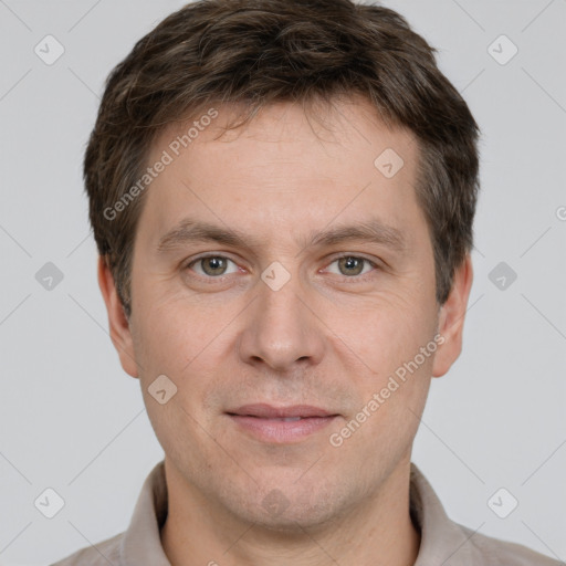 Joyful white adult male with short  brown hair and grey eyes