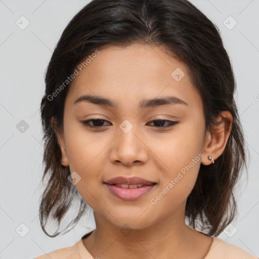 Joyful latino young-adult female with medium  brown hair and brown eyes