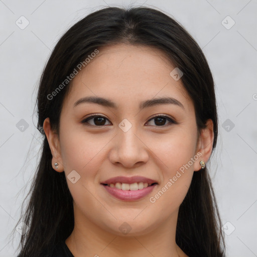 Joyful asian young-adult female with long  brown hair and brown eyes