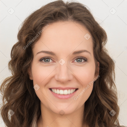 Joyful white young-adult female with long  brown hair and green eyes