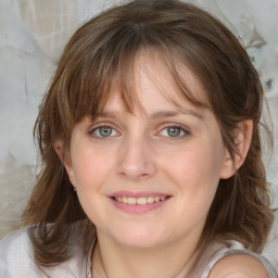 Joyful white young-adult female with medium  brown hair and blue eyes