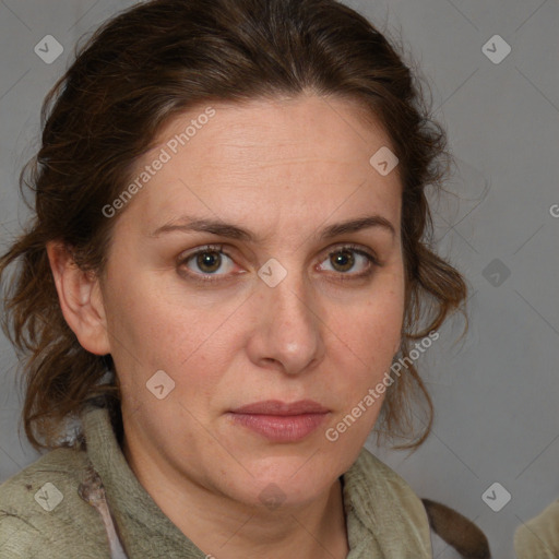 Joyful white adult female with medium  brown hair and blue eyes