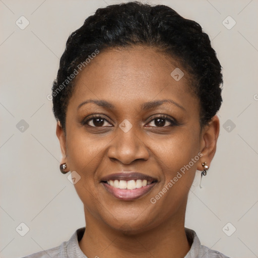 Joyful latino young-adult female with short  black hair and brown eyes