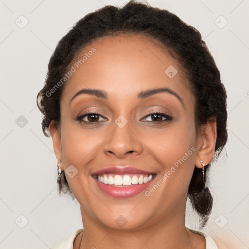 Joyful latino young-adult female with long  brown hair and brown eyes