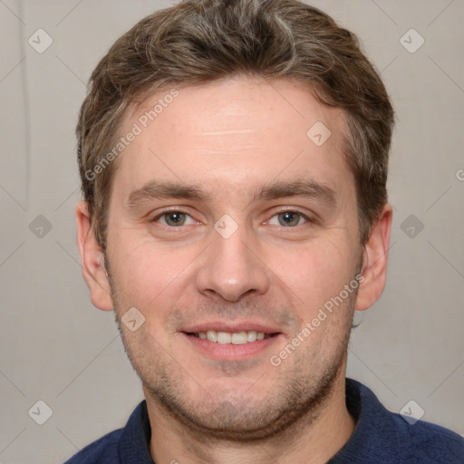 Joyful white adult male with short  brown hair and grey eyes