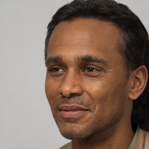 Neutral black adult male with short  black hair and brown eyes
