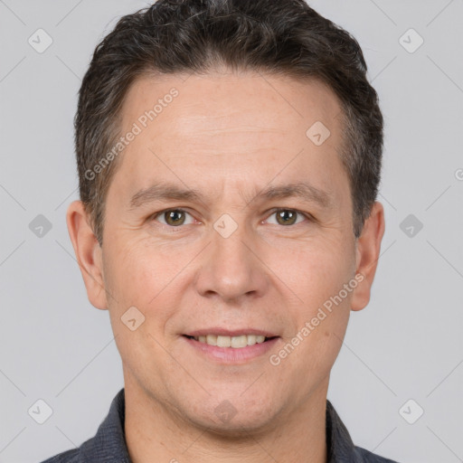 Joyful white adult male with short  brown hair and brown eyes