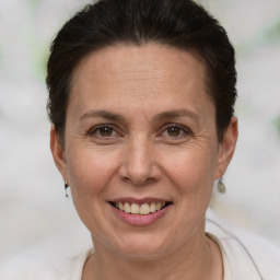 Joyful white adult female with short  brown hair and brown eyes