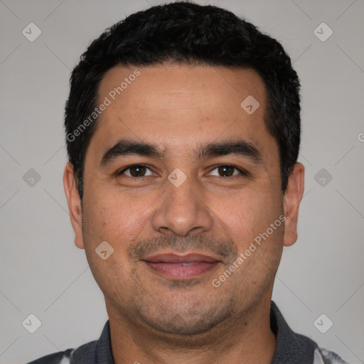 Joyful white young-adult male with short  black hair and brown eyes