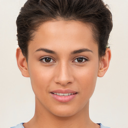 Joyful white young-adult female with short  brown hair and brown eyes