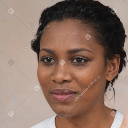 Joyful black young-adult female with medium  black hair and brown eyes