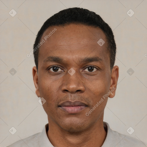 Neutral black adult male with short  black hair and brown eyes