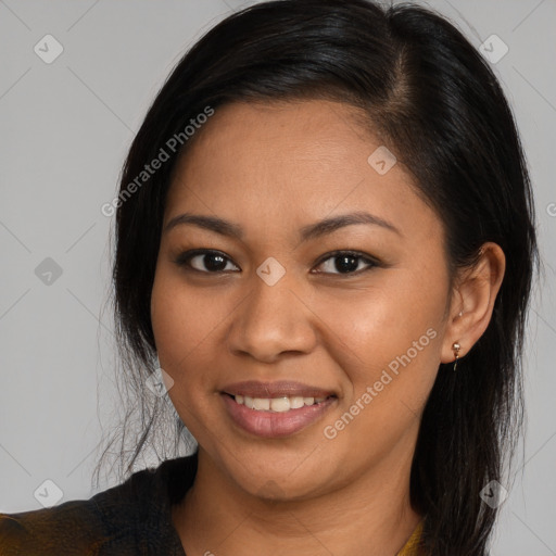 Joyful latino young-adult female with long  brown hair and brown eyes