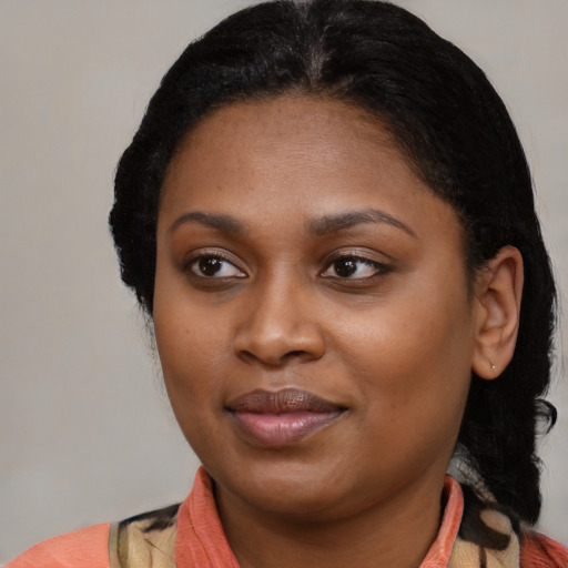 Joyful black young-adult female with medium  black hair and brown eyes