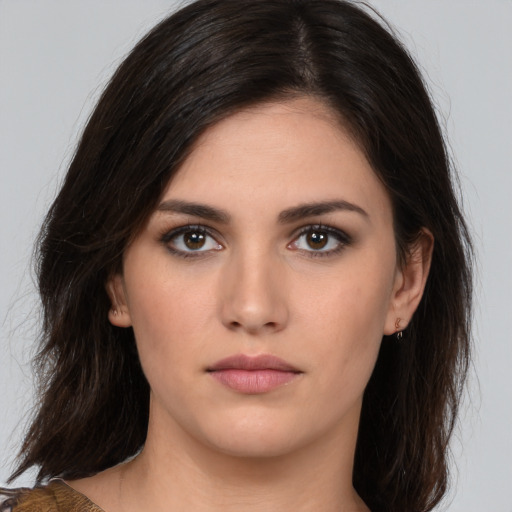 Neutral white young-adult female with medium  brown hair and brown eyes