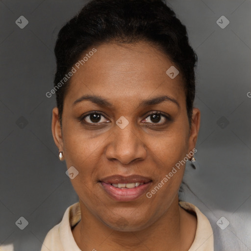 Joyful black adult female with short  brown hair and brown eyes