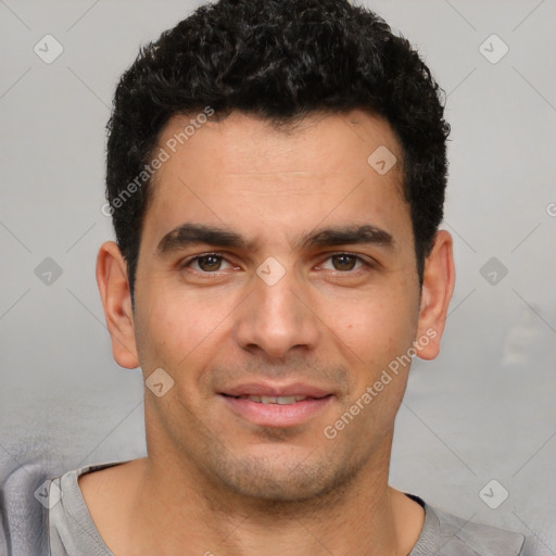 Joyful white young-adult male with short  black hair and brown eyes