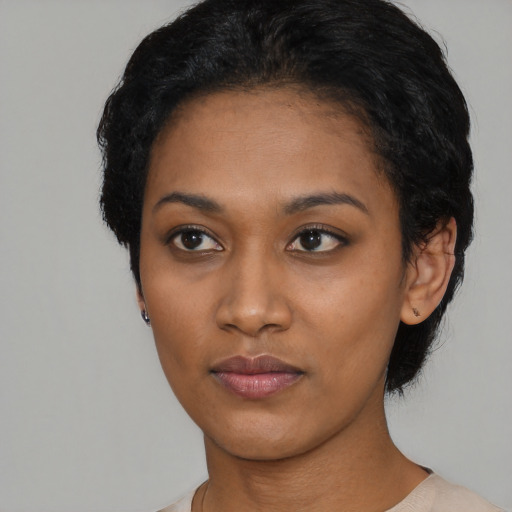 Neutral black young-adult female with short  black hair and brown eyes