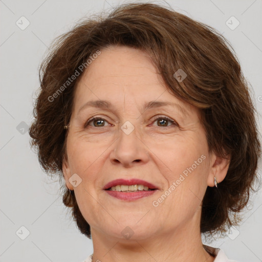 Joyful white middle-aged female with medium  brown hair and brown eyes