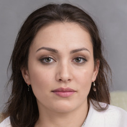 Neutral white young-adult female with medium  brown hair and brown eyes