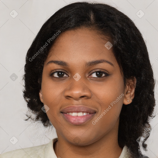 Joyful black young-adult female with medium  black hair and brown eyes