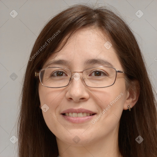 Joyful white adult female with long  brown hair and grey eyes