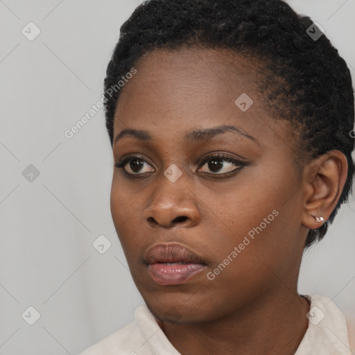 Neutral black young-adult female with short  black hair and brown eyes