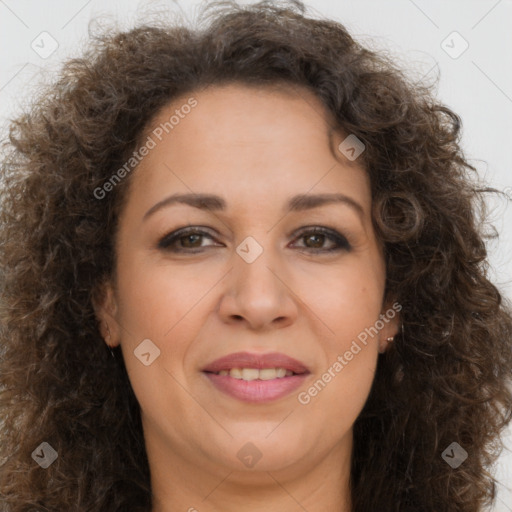 Joyful white adult female with long  brown hair and brown eyes