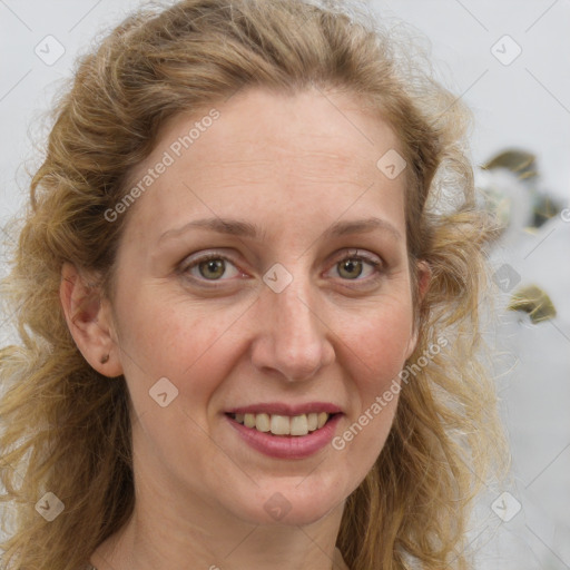 Joyful white adult female with long  brown hair and brown eyes