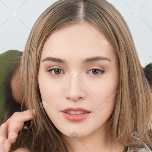 Neutral white young-adult female with long  brown hair and brown eyes