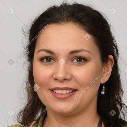 Joyful white adult female with long  brown hair and brown eyes