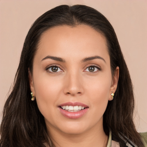 Joyful white young-adult female with long  brown hair and brown eyes