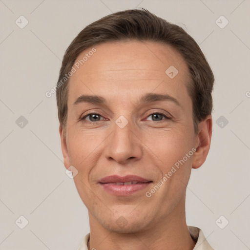 Joyful white adult male with short  brown hair and brown eyes