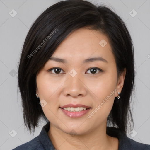 Joyful asian young-adult female with medium  black hair and brown eyes