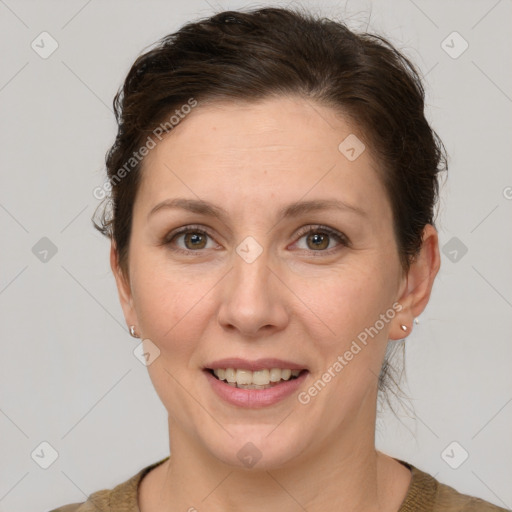 Joyful white adult female with short  brown hair and grey eyes