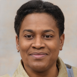 Joyful latino adult male with short  brown hair and brown eyes