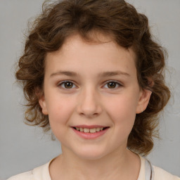 Joyful white child female with medium  brown hair and brown eyes