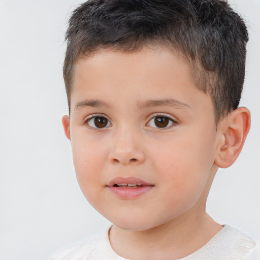 Joyful white child male with short  brown hair and brown eyes