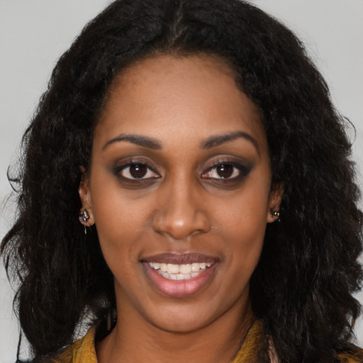 Joyful latino young-adult female with long  black hair and brown eyes